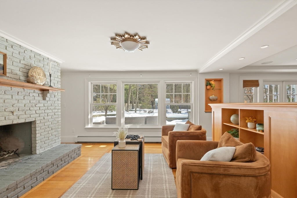 30 Underhill Road Lynnfield, MA 01940 - Photo 20 of 39 a living room with furniture and a fireplace