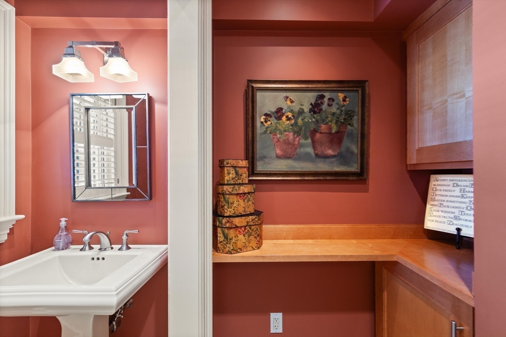 30 Underhill Road Lynnfield, MA 01940 - Photo 23 of 39 a bathroom with a sink a mirror and a window