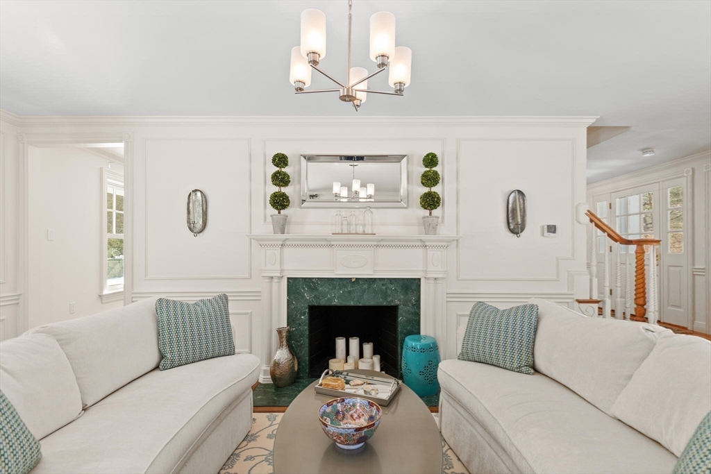 30 Underhill Road Lynnfield, MA 01940 - Photo 28 of 39 a living room with furniture and a fireplace