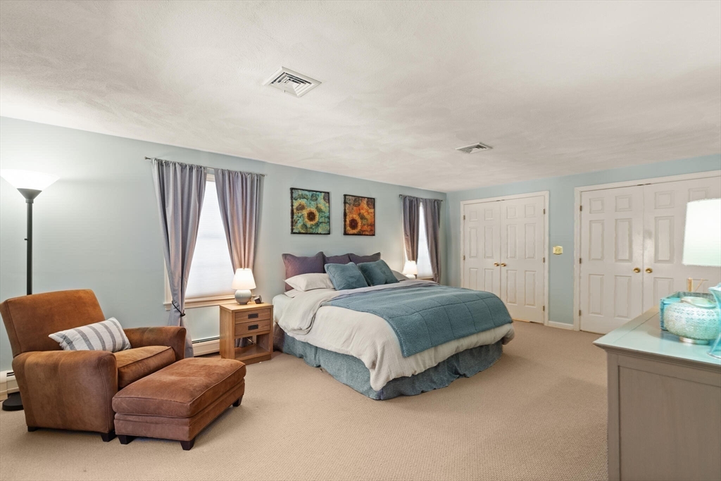 30 Underhill Road Lynnfield, MA 01940 - Photo 30 of 39 a bedroom with a bed couch and window