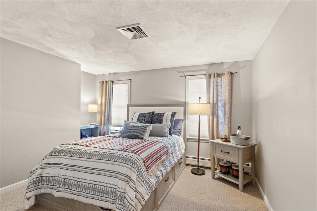 30 Underhill Road Lynnfield, MA 01940 - Photo 33 of 39 a bedroom with a bed and a window