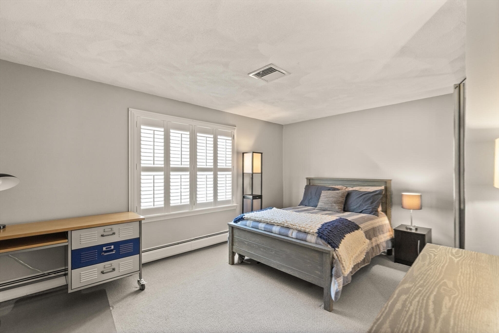 30 Underhill Road Lynnfield, MA 01940 - Photo 35 of 39 a bed room with a bed and a window