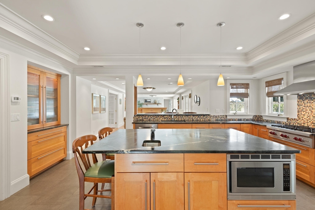 30 Underhill Road Lynnfield, MA 01940 - Photo 8 of 39 a kitchen with stainless steel appliances granite countertop a sink and a granite counter tops