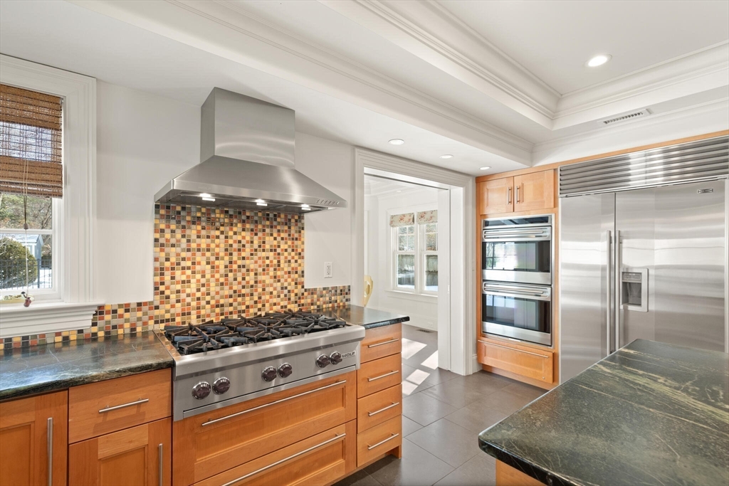 30 Underhill Road Lynnfield, MA 01940 - Photo 9 of 39 a kitchen with stainless steel appliances granite countertop a stove and a refrigerator