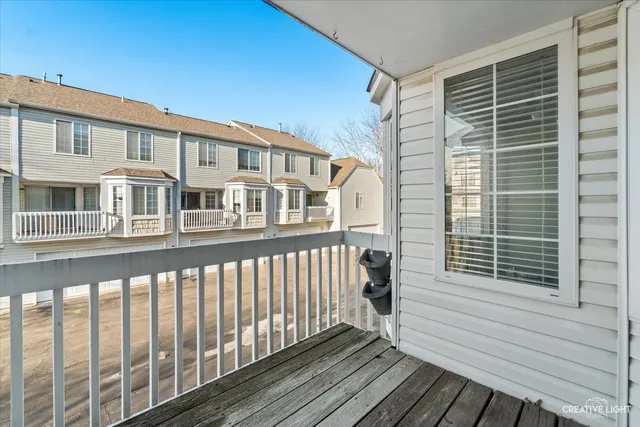 a view of a balcony with a barbeque