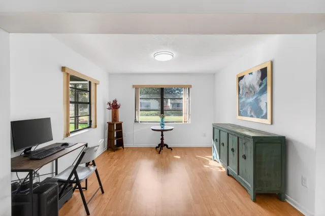 a bathroom with a granite countertop bathtub shower sink and toilet