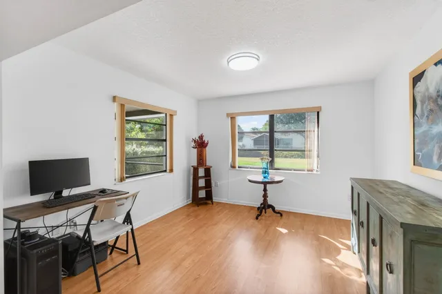 a view of a house with a yard and front view of a house