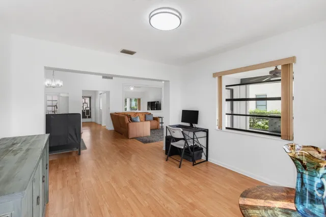 a view of a house with swimming pool and a yard