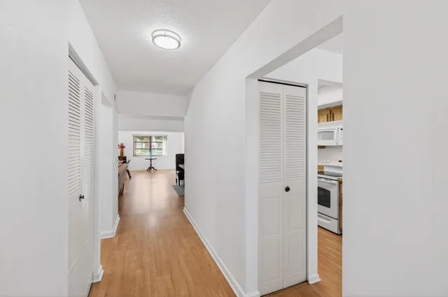 a view of a lake with houses in the background