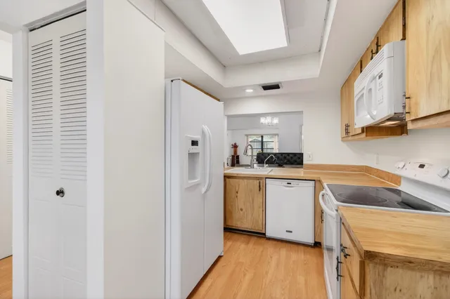 a front view of a house with a garage