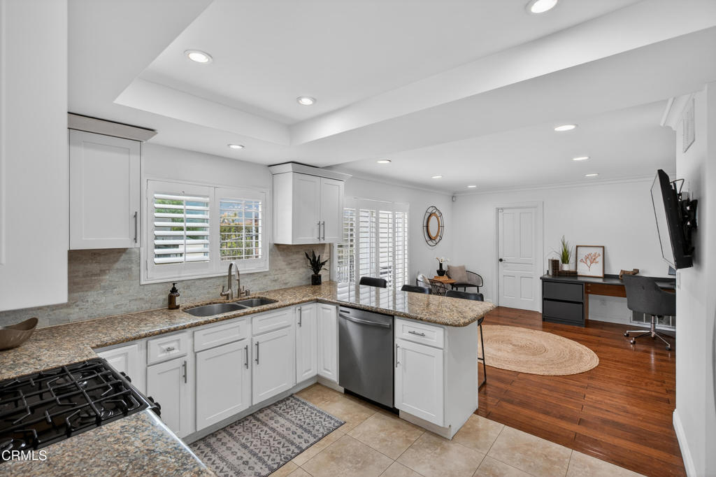 9325 La Shell Drive Tujunga, CA 91042 - Photo 14 of 46 a kitchen with a sink stove and cabinets