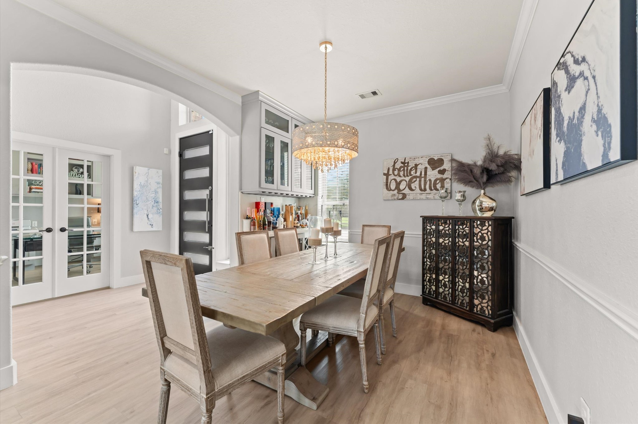 14016 Savannah Landing Lane Rosharon, TX 77583 - Photo 7 of 49 a view of a dining room with furniture and wooden floor