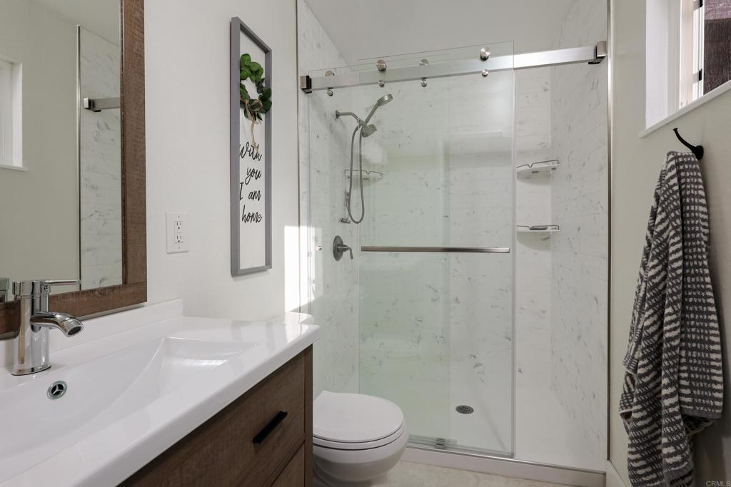 1024 Ransom Street San Diego, CA 92154 - Photo 24 of 41 a bathroom with a sink a toilet and shower
