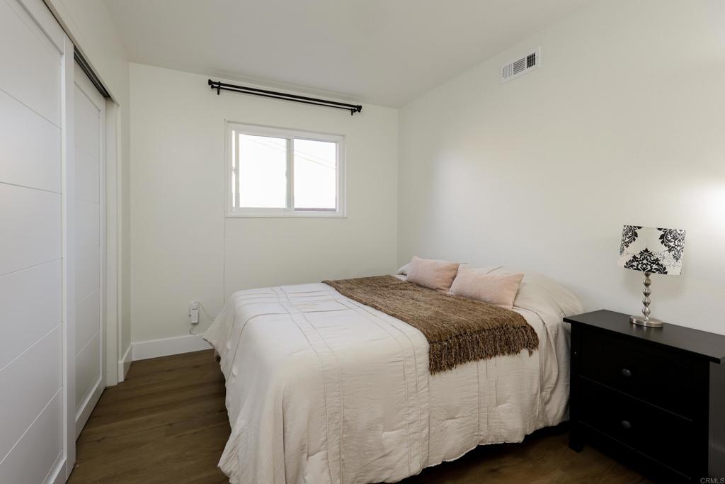 1024 Ransom Street San Diego, CA 92154 - Photo 26 of 41 a bedroom with a bed and a potted plant