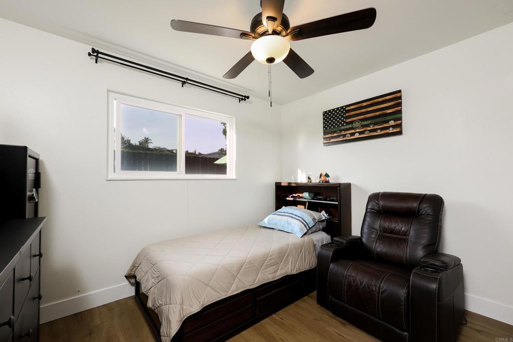 1024 Ransom Street San Diego, CA 92154 - Photo 27 of 41 a bedroom with a bed couch and a ceiling fan