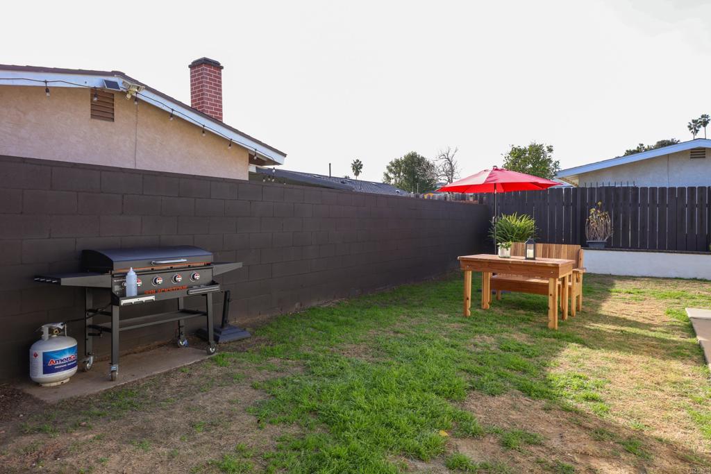 1024 Ransom Street San Diego, CA 92154 - Photo 31 of 41 a backyard of a house with table and chairs