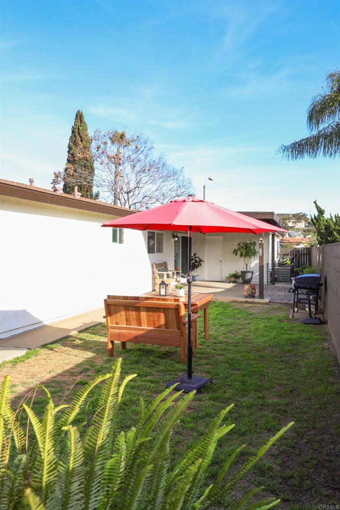 1024 Ransom Street San Diego, CA 92154 - Photo 34 of 41 a view of a backyard with a garden and deck