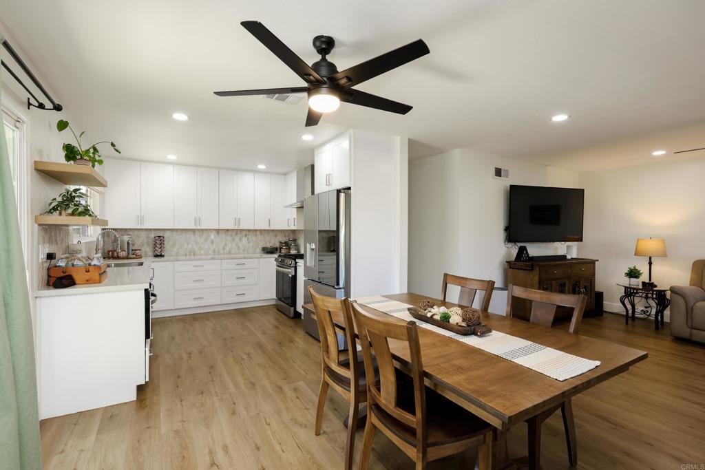 1024 Ransom Street San Diego, CA 92154 - Photo 5 of 41 a kitchen with a table chairs refrigerator and microwave
