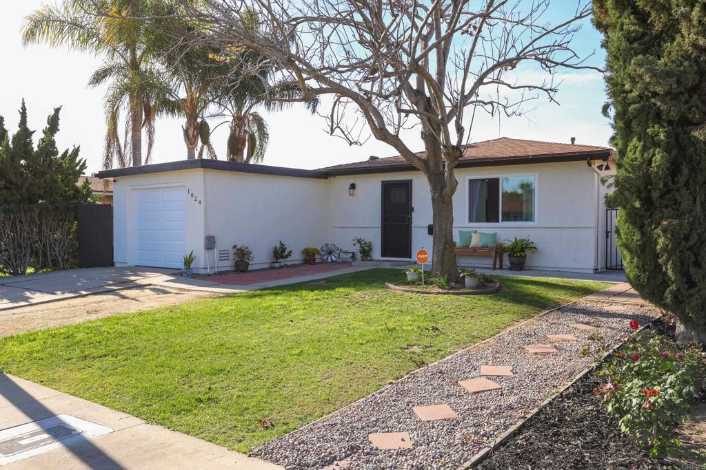 1024 Ransom Street San Diego, CA 92154 - Photo 9 of 41 a view of a backyard with a large tree