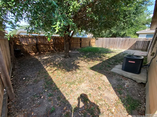 a view of a backyard with a swing