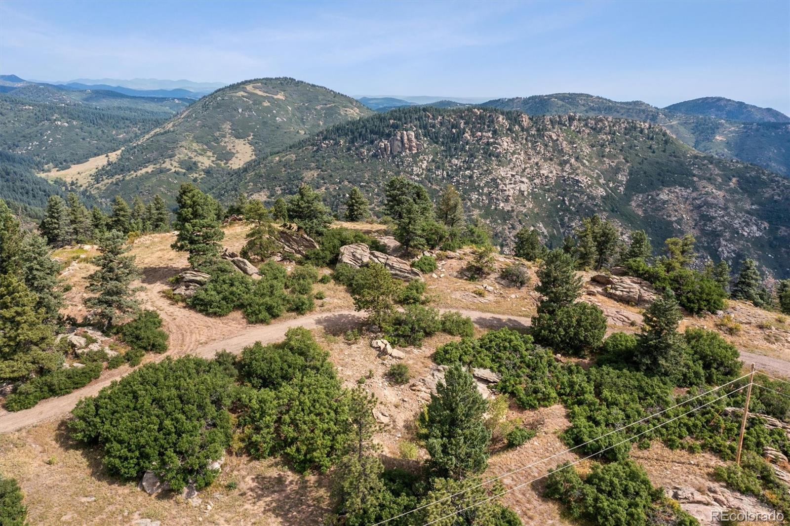 13854 North Trail Circle Littleton, CO 80127 - Photo 12 of 17 a view of a city with mountains in the background