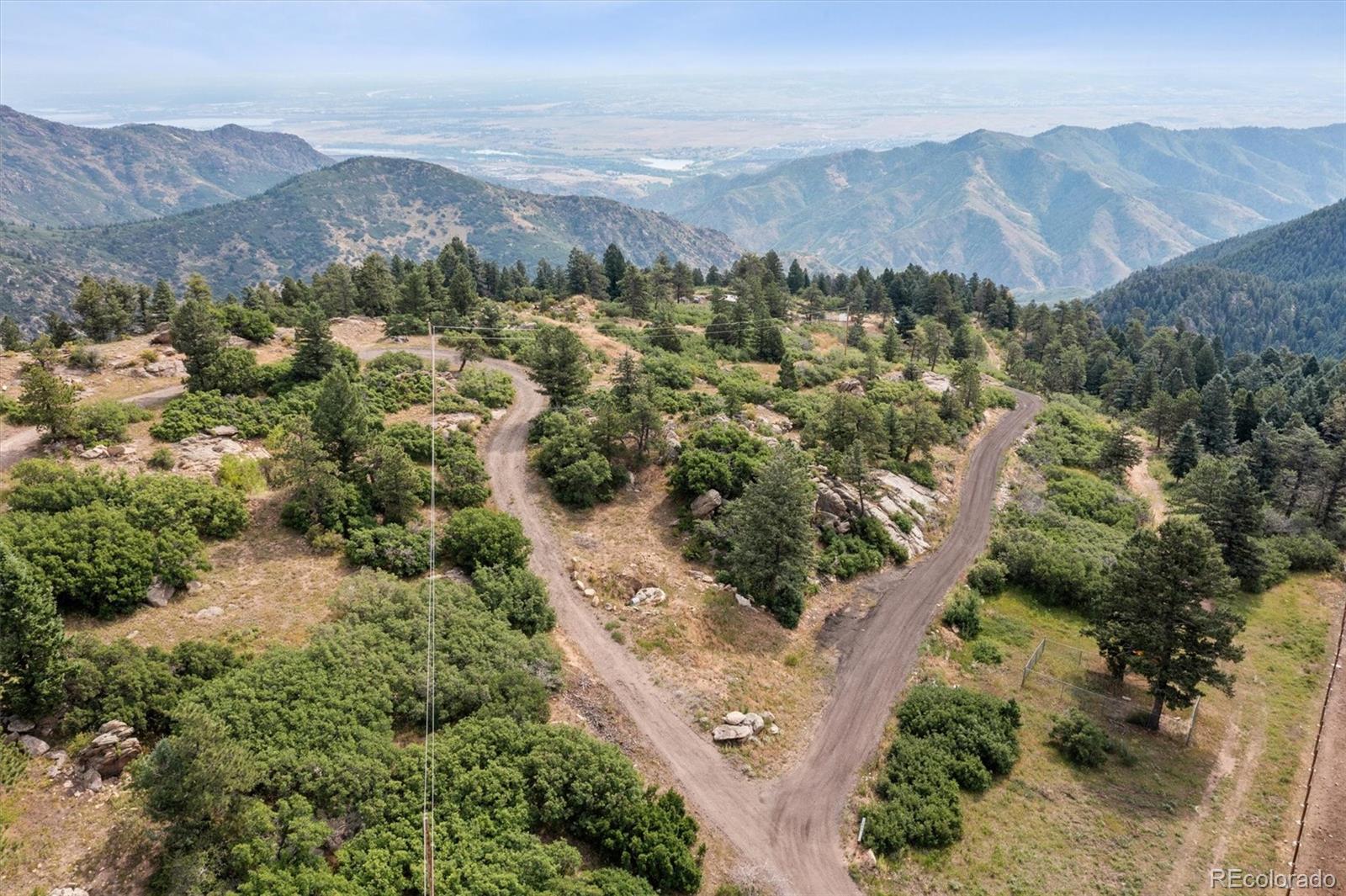 13854 North Trail Circle Littleton, CO 80127 - Photo 14 of 17 an aerial view of mountain and residential houses