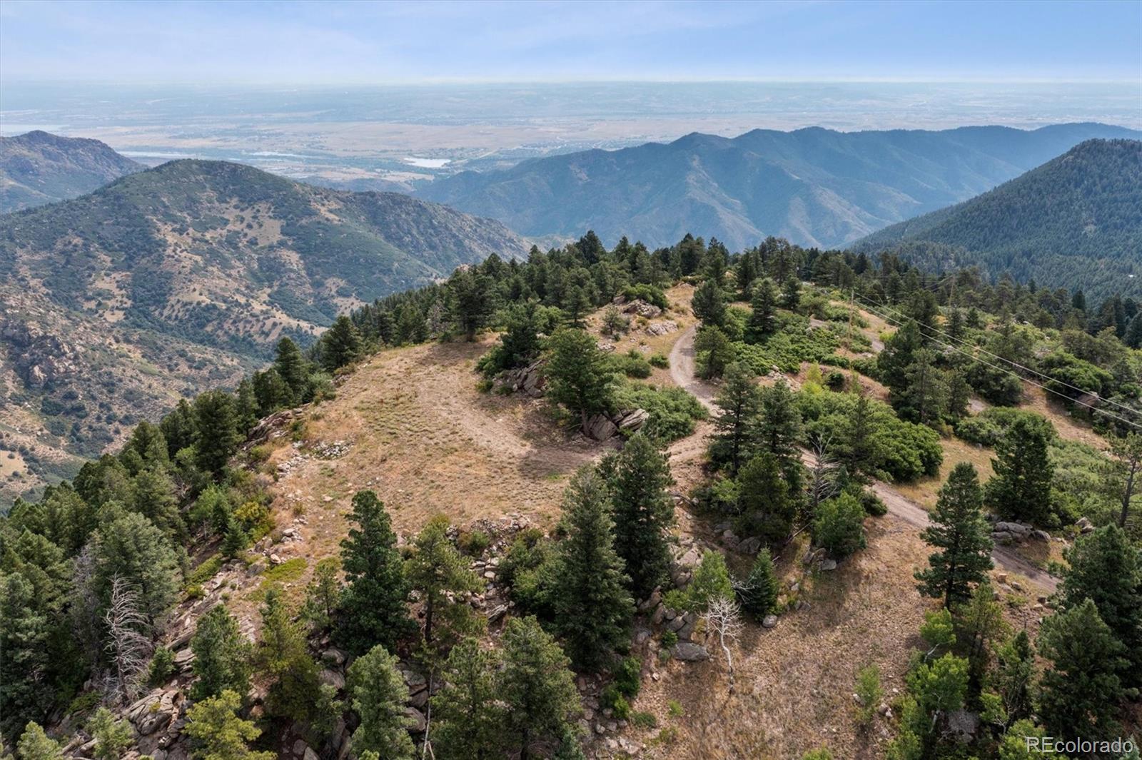 13854 North Trail Circle Littleton, CO 80127 - Photo 2 of 17 a view of a city with mountains in the background