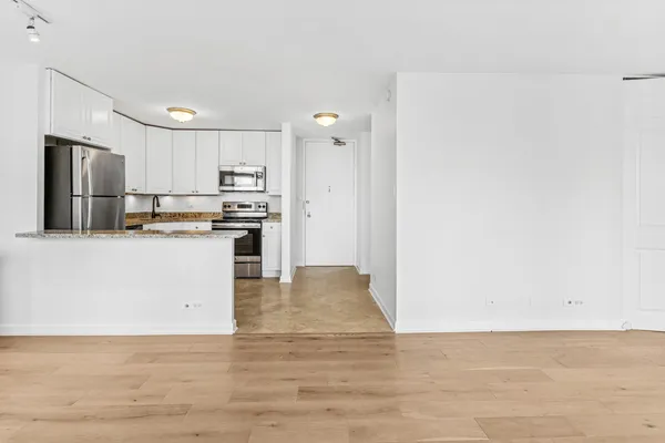 a view of kitchen with wooden floor
