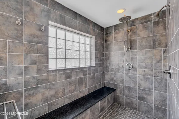 a large kitchen with lots of counter top space and stainless steel appliances