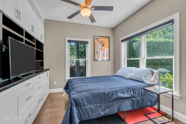 a view of a house with backyard sitting area and swimming pool