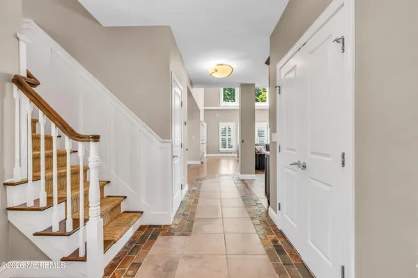 a large kitchen with lots of counter top space and stainless steel appliances