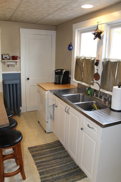 58 Larkspur Street Springfield, MA 01108 - Photo 12 of 29 a kitchen with stainless steel appliances granite countertop a sink and a stove