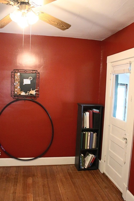 58 Larkspur Street Springfield, MA 01108 - Photo 22 of 29 a view of an empty room with wooden floor and a window