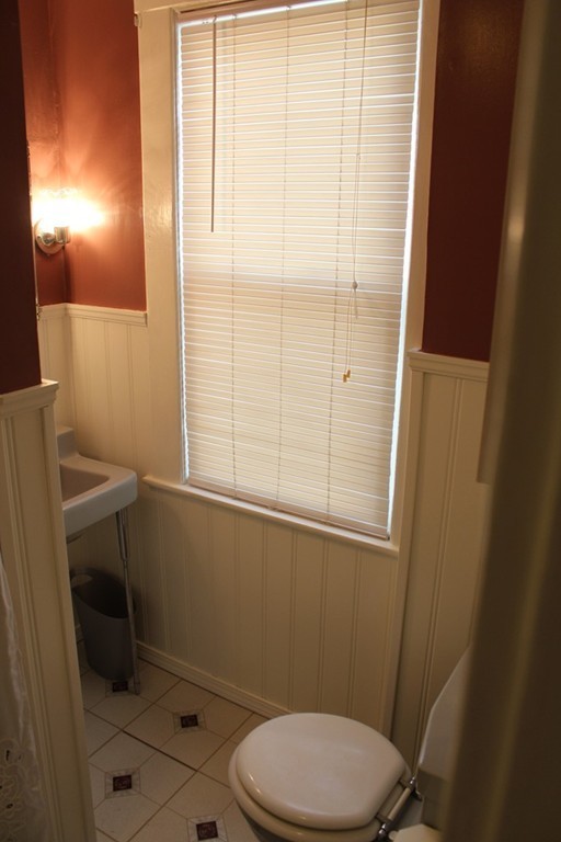 58 Larkspur Street Springfield, MA 01108 - Photo 26 of 29 a bathroom with a toilet a sink and a shower