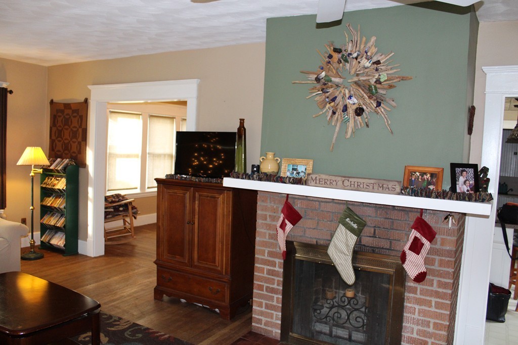 58 Larkspur Street Springfield, MA 01108 - Photo 7 of 29 a living room with furniture and a flat screen tv