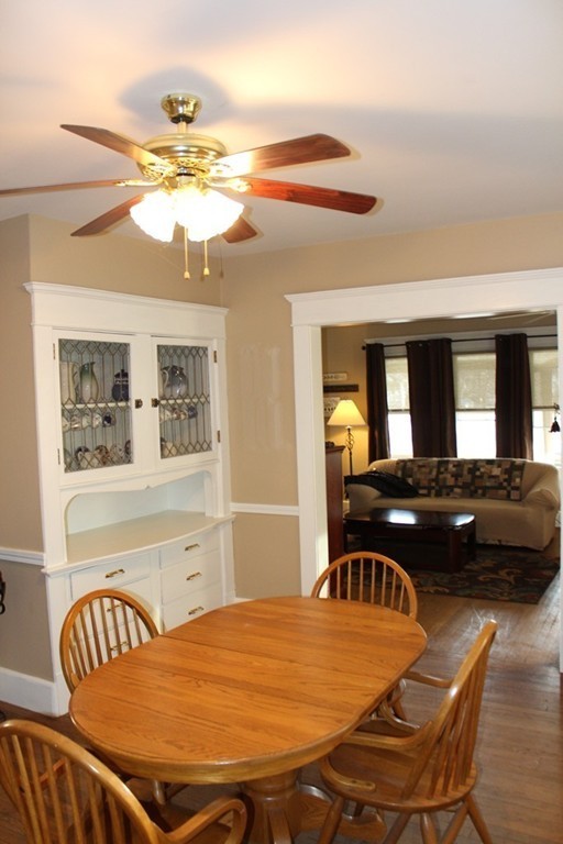58 Larkspur Street Springfield, MA 01108 - Photo 9 of 29 a bedroom with a bed and a chandelier