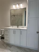 2700 Old Denton Road, Unit 1043 Carrollton, TX 75007 - Photo 3 of 14 Full bathroom with vanity and a shower with shower curtain