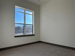 2700 Old Denton Road, Unit 1043 Carrollton, TX 75007 - Photo 5 of 14 Empty room with baseboards
