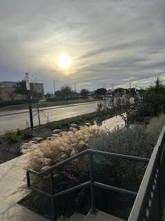 2700 Old Denton Road, Unit 1043 Carrollton, TX 75007 - Photo 10 of 14 Yard at dusk with a balcony