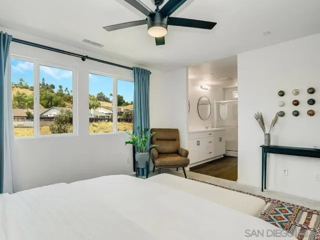 a bedroom with furniture and window