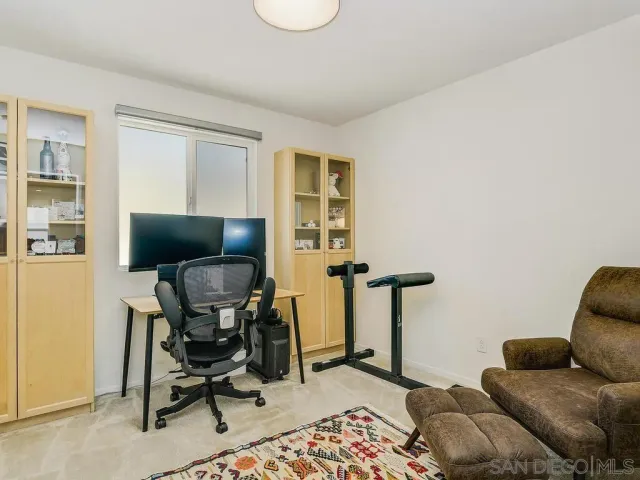 a living room with furniture and a chair