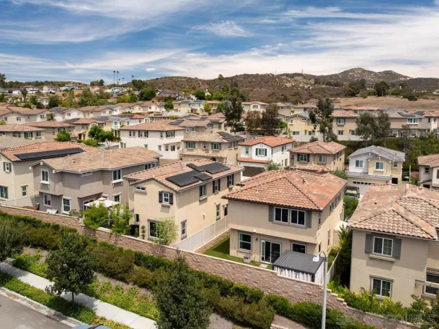 a view of residential houses with a city view