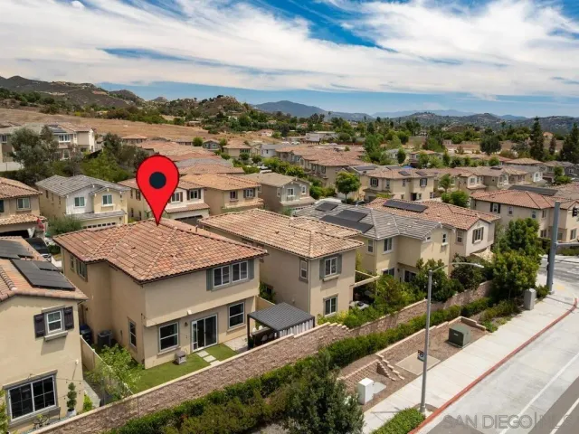 a view of multiple houses with a city