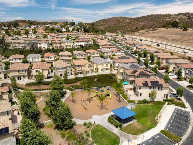 an aerial view of residential houses with outdoor space