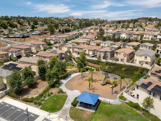 an aerial view of residential houses with outdoor space