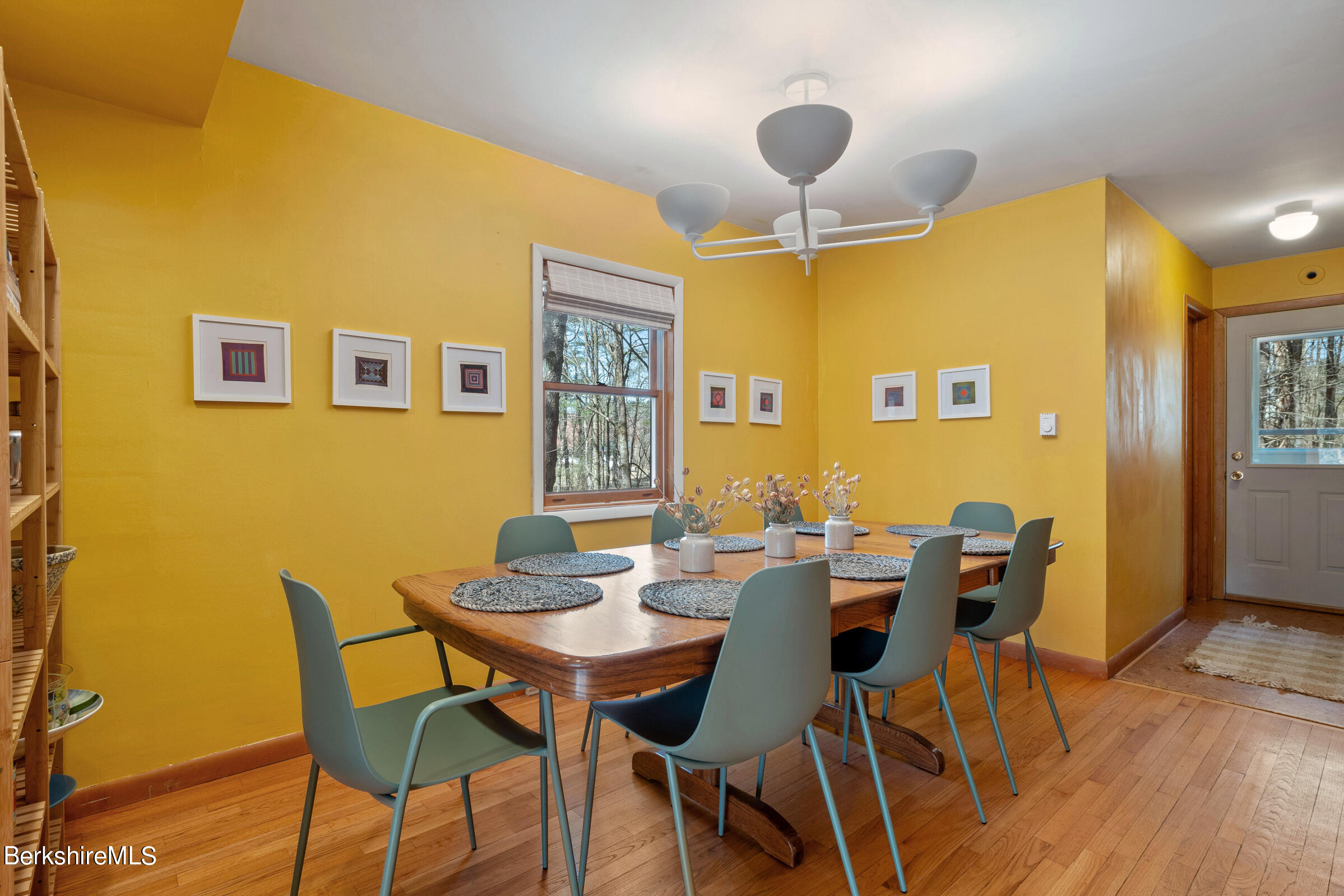 11 Pine Knoll Road Lenox, MA 01240 - Photo 18 of 35 a view of a dining room with furniture and wooden floor
