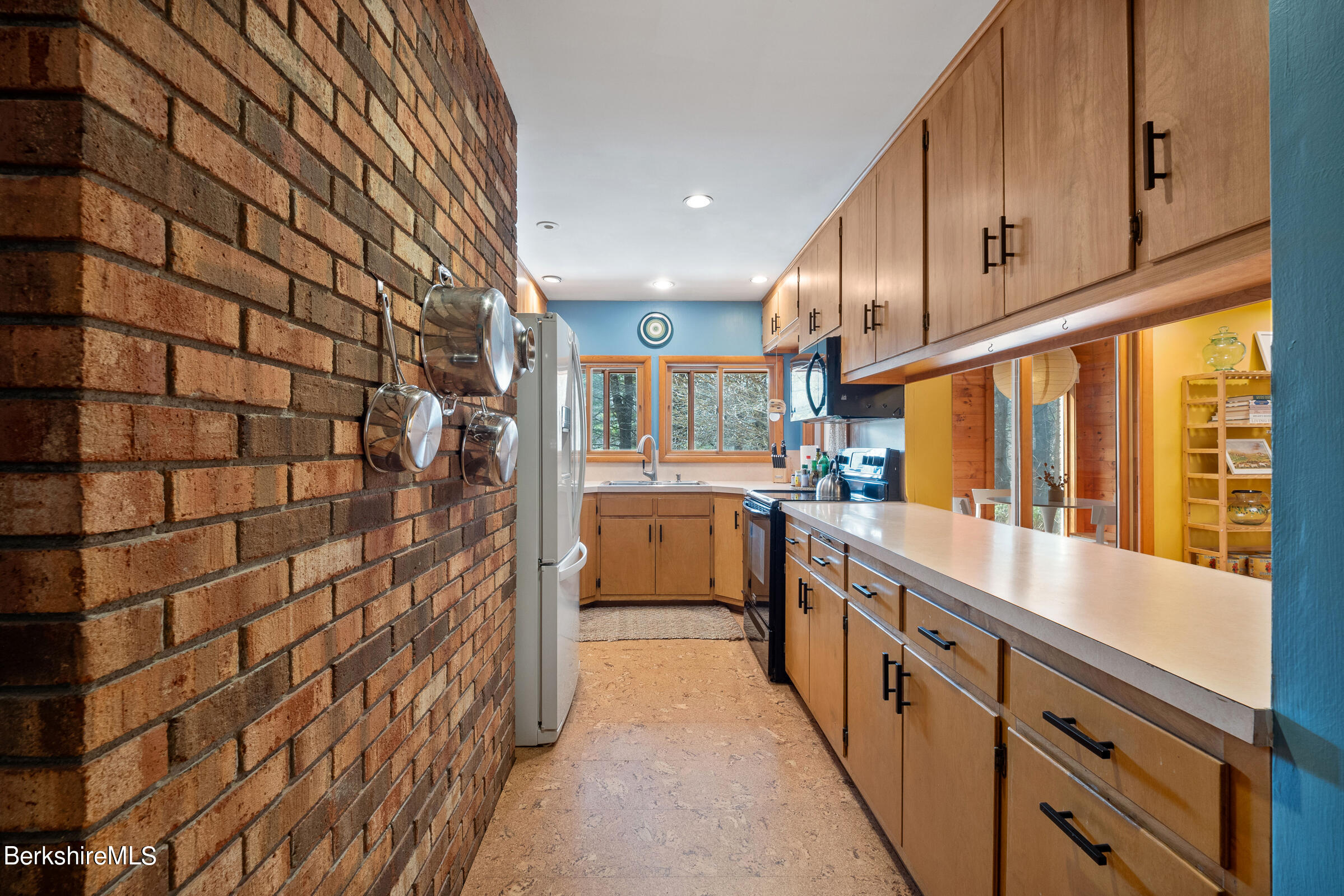 11 Pine Knoll Road Lenox, MA 01240 - Photo 19 of 35 a kitchen with stainless steel appliances a sink and cabinets