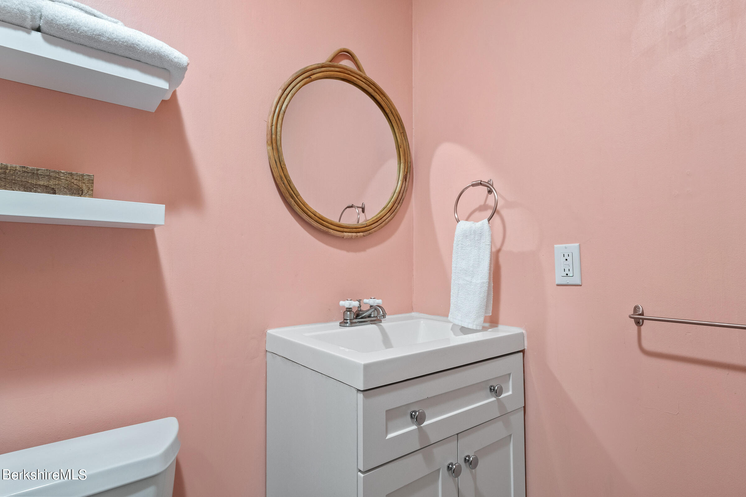 11 Pine Knoll Road Lenox, MA 01240 - Photo 21 of 35 a bathroom with a sink vanity and a mirror