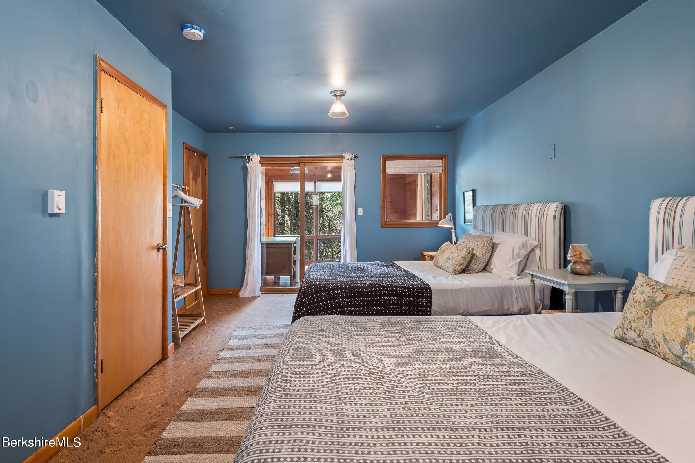 11 Pine Knoll Road Lenox, MA 01240 - Photo 25 of 35 a bedroom with a large bed and a couch