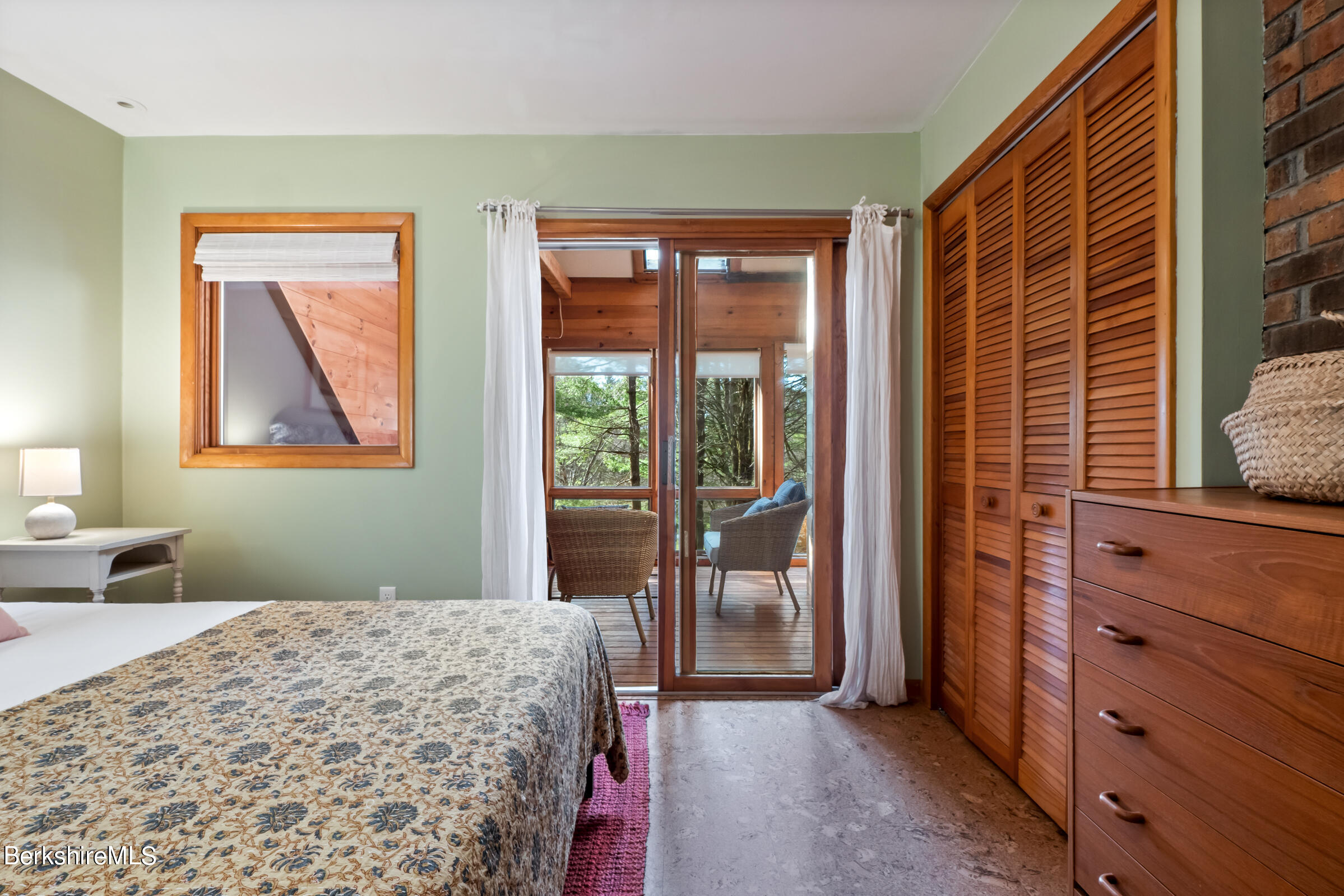 11 Pine Knoll Road Lenox, MA 01240 - Photo 28 of 35 a bedroom with a bed and a dresser next to a window